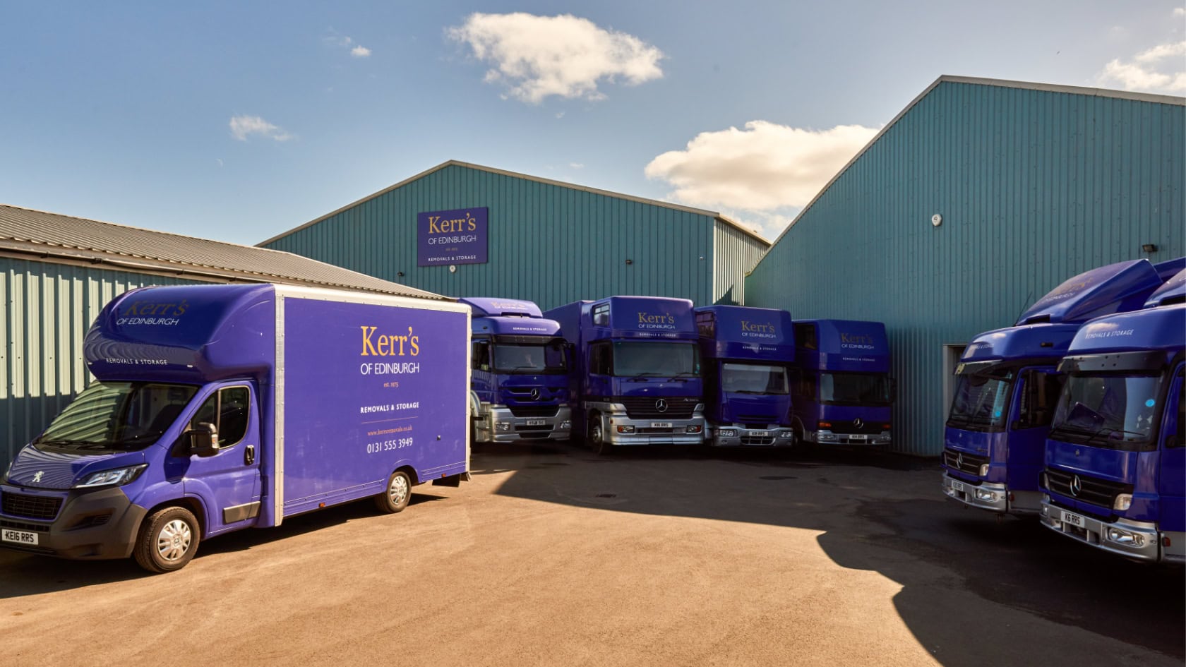 Fleet of Kerr’s Removals vans at Edinburgh depot, showcasing BAR-approved moving and storage services