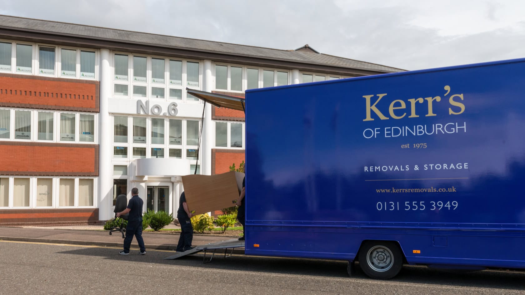 Kerr’s Removals van and team unloading office furniture during a business relocation in Edinburgh