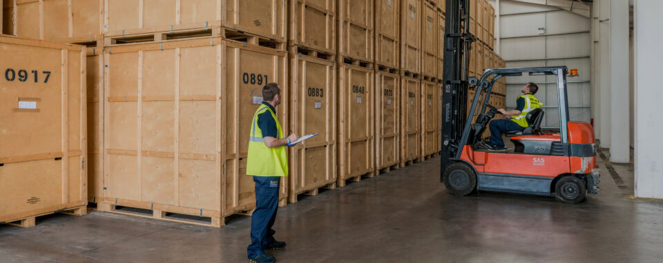 Storage Edinburgh - Kerr's team managing wooden self-storage vaults inside secure warehouse