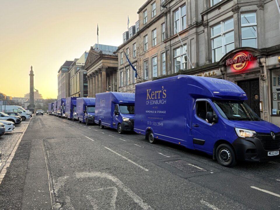 Kerr's vans and lorries on George Street, Edinburgh, at sunrise